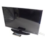 A Samsung 32" colour TV, in black trim with remote control and wire.