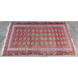 A Persian rug in floral decoration, the outer field of geometric floral pattern, the inner with a ge