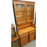 An oak dresser with two glazed doors.