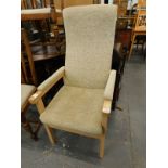 A modern beech open armchair, upholstered in beige fabric.