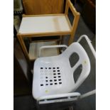 A mobility aid commode and a two tier table.