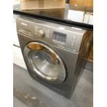 A Samsung Eco bubble 7.0kg washing machine in dark grey.