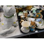 A porcelain cat ornament decorated with flowers, various other ornaments to include, bird figures, e