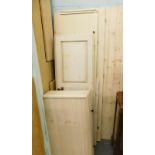 A cream painted wardrobe, disassembled. (AF)