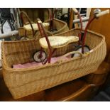 A child's toy tricycle, Kelo Ltd, and a Moses basket.