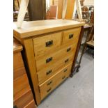 An oak chest of two short and four long drawers, each with brass handles.