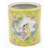 A 19thC Chinese porcelain famille jaune brush pot, with scrolling floral ground containing two shape