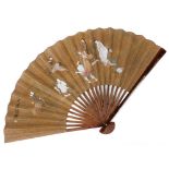 An early 20thC Chinese bamboo and paper fan, painted with figures from folklore including a woman ri