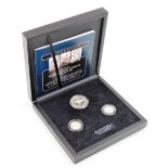 A Britain's Longest Reigning Monarchs silver coin set, with certificate of authenticity, etc.