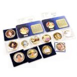 A group of Royal related gold coloured coins or medallions, to include two Golden Wedding issues, an
