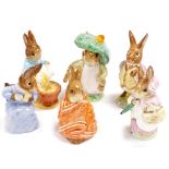 A group of Beswick Beatrix Potter figures, comprising Mrs Rabbit, Cottontail, Poorly Peter Rabbit, B