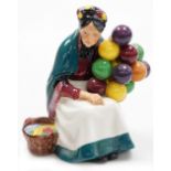 A Royal Doulton porcelain figure, The Old Balloon Seller, HN1315.