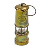 A Hockley Lamp and Limelight Company brass miner's lamp, 17cm high.