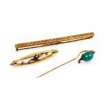 Two brooches and a stick pin, comprising an Edwardian 9ct gold oval bar, with pierced central swallo