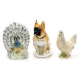 Three ceramic figures, comprising a Valencian porcelain peacock 20cm high, a hen 16cm high, and a Lo