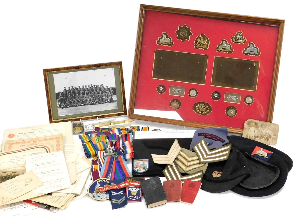 Militaria and sundry ephemera, relating to the Hopper family of Lincolnshire, including cap badges,