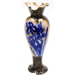 A Royal Doulton porcelain vase, with a flared wave rim, tapering body on a shaped foot, the body dec