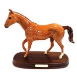 A Royal Doulton pottery figure modelled as My First Horse, raised on an oval base, printed mark.