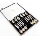 A set of twelve George VI silver teaspoons and sugar tongs, in fitted box, Sheffield 1941, 5oz.