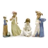 Four Nao porcelain figures, comprising girl feeding lamb, 17cm high, girl holding puppy, 22cm high,