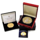 A Queen Elizabeth II super size 65mm five pound proof coin, and a Royal Mint issue super crown to ce