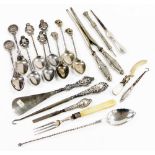 A group of white metal and silver mounted items, to include a shoe horn, white metal tea spoons with