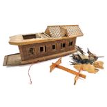 A vintage wooden scale model of an Indian riverboat, with carved decoration, and a fitted interior,