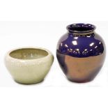 A Moorcroft pottery purple lustre vase, of globular form with a raised lip, impressed marks to under