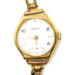 A Rotary 9ct gold lady's wristwatch, the watch head in a 9ct gold case with cream coloured dial and