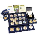 A group of gold coloured commemorative coins, to include Celebration of Steam Locomotives, and vario