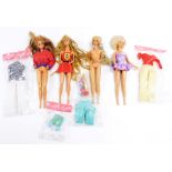 Four Mattel Barbie dolls, with various clothing.