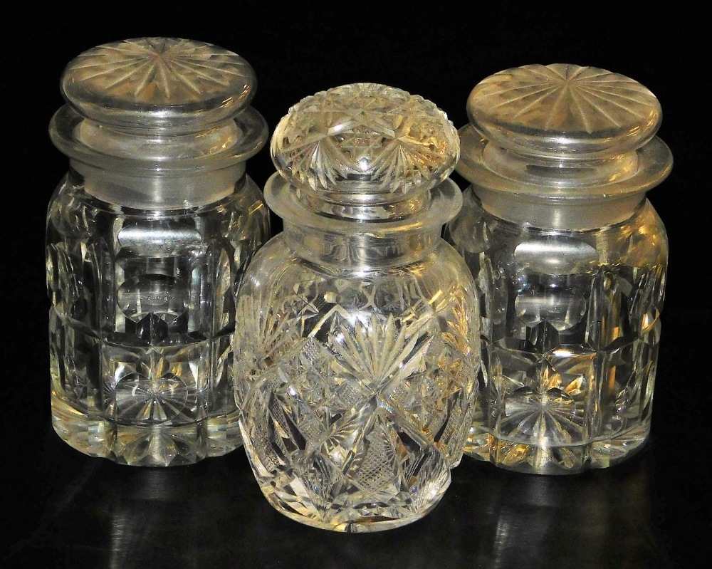 Three cut glass pickle jars and covers, comprising a pair, 12cm high, and a further example, 5cm hig