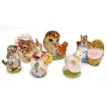 A group of Beswick pottery Beatrix Potter figures, comprising Beswick Miss Moppet, Mrs Rabbit, Hunca