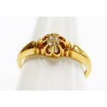 An 18ct gold diamond dress ring, the tiny diamond in cluster claw setting with etched design shoulde