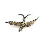 A swallow brooch, the out spanned wings set with paste stones, in a white metal casing on single pin