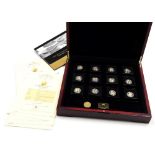 A set of twelve Fabula Aurum gold coins, from the year 2009, with certificates, boxed, each 0.5g.