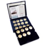 A part set of RMS Titanic Centenary gold coloured medallions, issued by Westminster Mint.