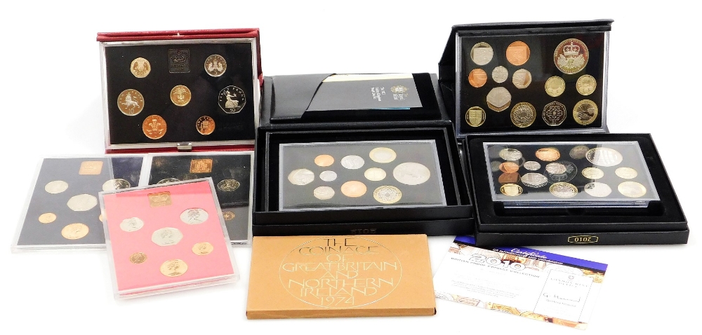 A 2012 United Kingdom proof coin set, 2010 British proof coin collection set, and other annual coin