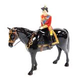 A Beswick 'Trooping The Colour' porcelain figure group, of Her Majesty The Queen on a Burmese horse,