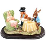 A Royal Doulton Beswick ware 'The Mad Hatters Tea Party' figure group, modelled by Martyn C.R. Alwic