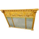A 19thC gilt over mantel mirror, the inverted break front cornice mounted with spheres, above a Neoc