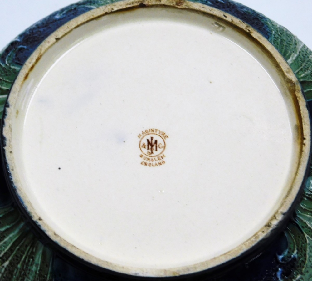 A Moorcroft Macintyre and Co Florian ware pottery tobacco jar, decorated with flowers against a text - Image 3 of 3