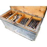 A carpenter's stained pine tool chest, containing moulding planes, saws, chisels, drill bits, set sq