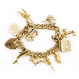 A 9ct gold curb link charm bracelet, with charms as fitted, on a heart shaped padlock clasp, 34.6g a