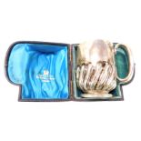 A Victorian silver christening cup, with semi fluted decoration, in presentation case for Gass & Co,