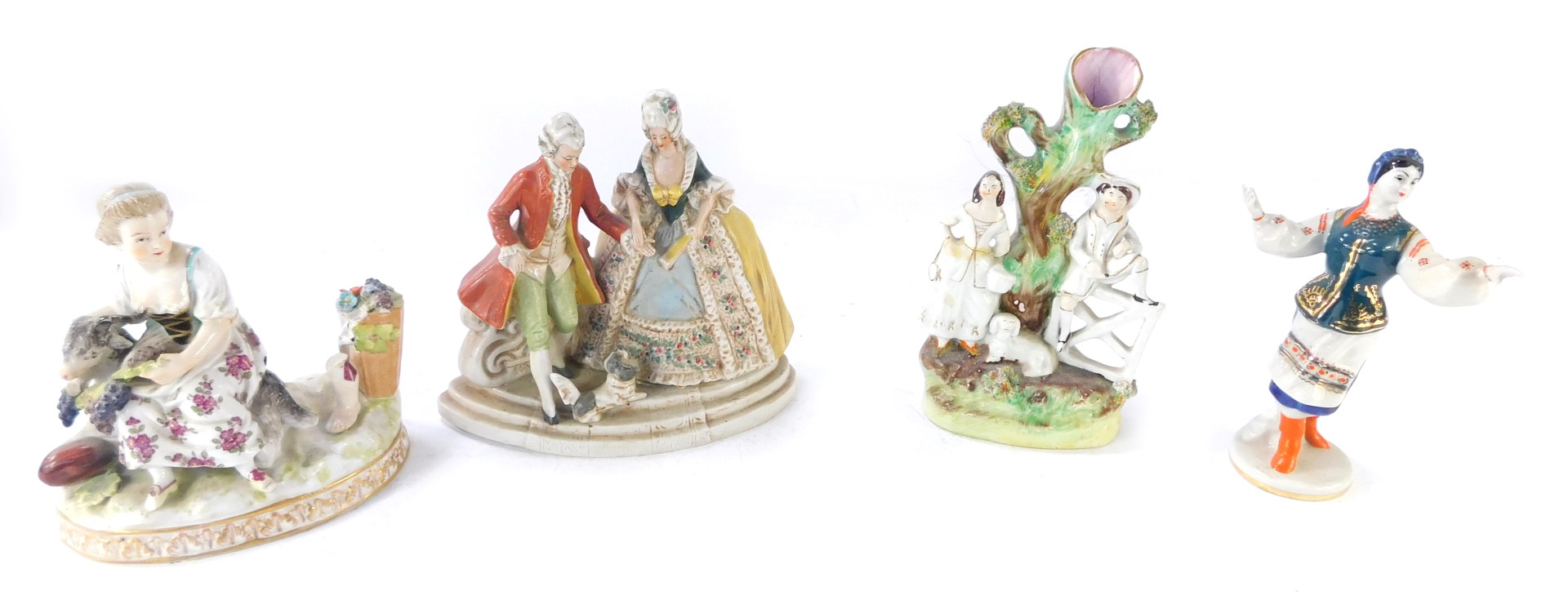 Four ceramic figures, comprising a German fete gallant group, Helena Wolfsohn type figure group (