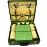 A Brexton picnic hamper, in a green case with plastic cream and green fittings, 13cm high, 40cm