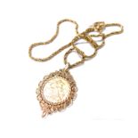 A Victorian full gold sovereign pendant and chain, dated 1890 in 9ct gold scroll pendant frame,