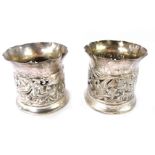 A pair of Edward VII silver bottle holders, with pierced and embossed decoration of birds, flowers