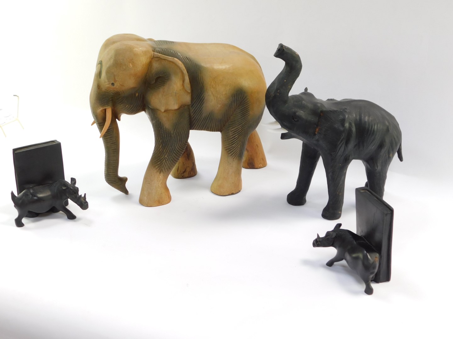 A group of carved wooden ornaments, comprising a large elephant 33cm high, a black stained - Image 3 of 4